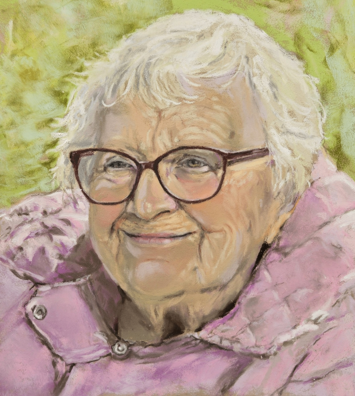 Private pastel portrait commission of a smiling older woman in burgundy glasses and a pink quilted coat.