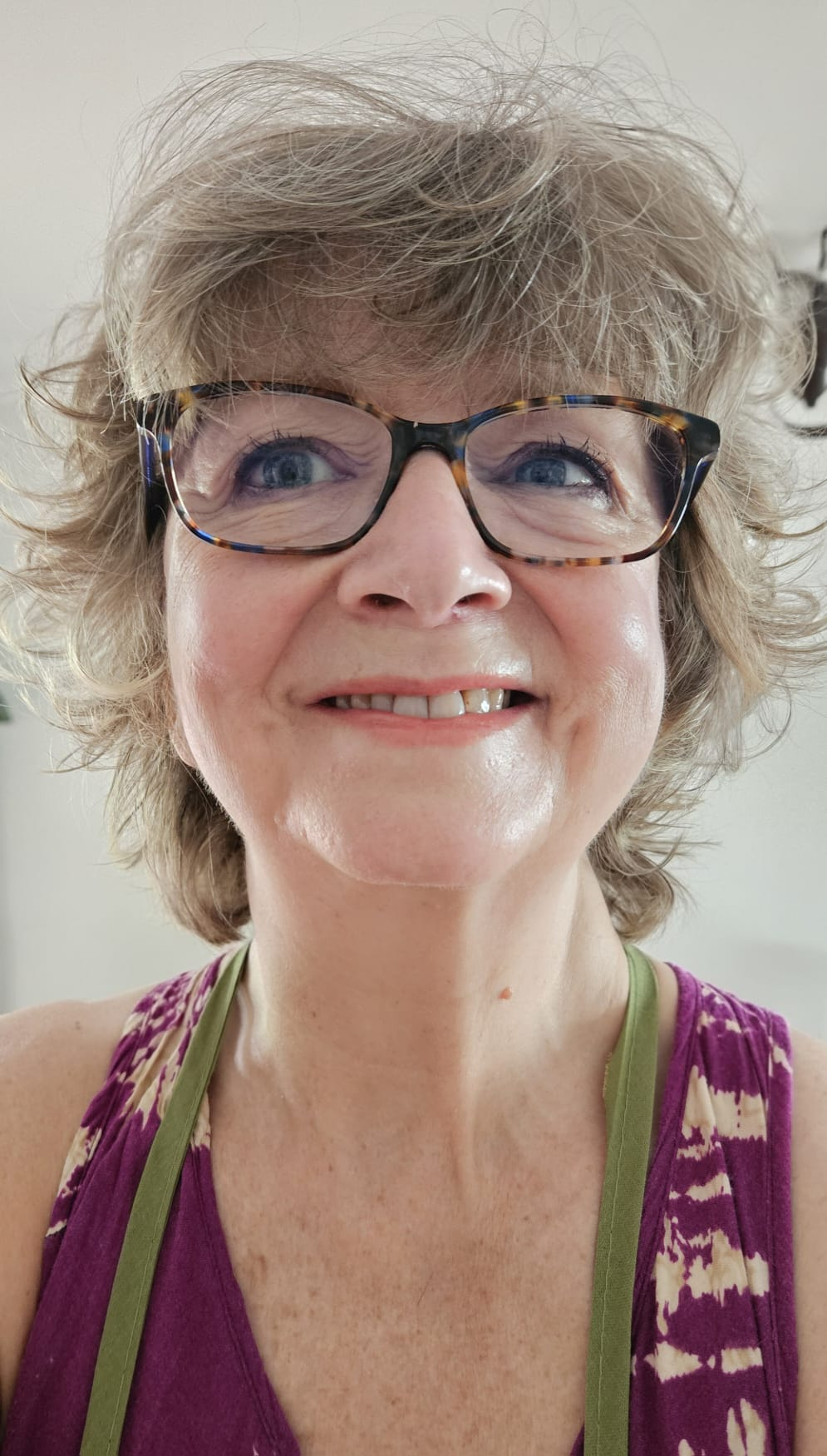 Leslie Robinson smiling in glasses
